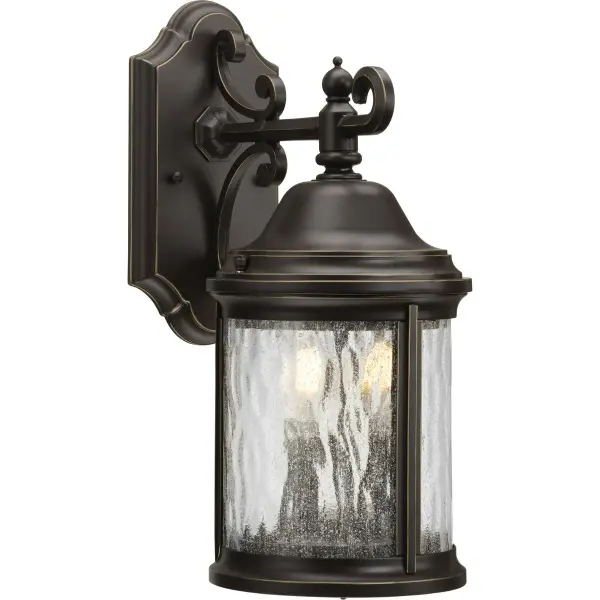 The Ashmore wall lantern brings timeless traditional styling to outdoor spaces with its antique bronze finish and clear glass panels. Two-light design provides ample illumination for entryways and porches.