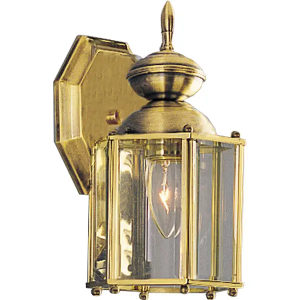 Brighten your outdoor space with style using this wall lantern. Featuring a classic design completed with clear beveled glass panels for ample lighting, this lamp boasts a beautiful brass finish for an appealing look. Solid brass wall lantern with clear beveled glass panels and an open bottom. Polished Brass finish. Collection: BrassGUARD Lantern Rooms: Outdoor Finish: Polished Brass Glass: Clear Beveled Width: 5.38" Height: 10.25" Weight: 2.40 lb Extension from Wall: 5.63" Top to Outlet: 3.75" Wire: 6" Canopy: 5.5"x4.75" Number of Bulbs: 1 Maximum Wattage: 100.00 W Bulb Type: A19 Bulb Base: E26 Light Source: Incandescent Voltage: 120.00 V Material: Solid Brass Country of Origin: CN Safety Listing: UL-CUL Safety Rating: Wet Title 20 Manufacturer Warranty: 1-year Limited Warranty Spec Sheet Instructions Parts Diagram