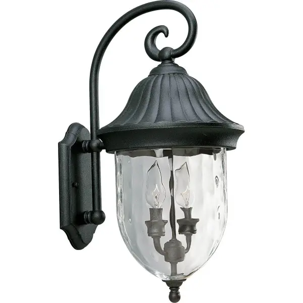 The Coventry wall lantern brings traditional elegance to outdoor spaces with its textured black finish and classic lantern silhouette. Two-light design provides ample illumination for entryways and patios.