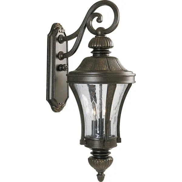 The Nottington Large Wall Lantern brings traditional charm to outdoor spaces with its forged bronze finish and three-light configuration. Perfect for illuminating entryways and porches with timeless style.