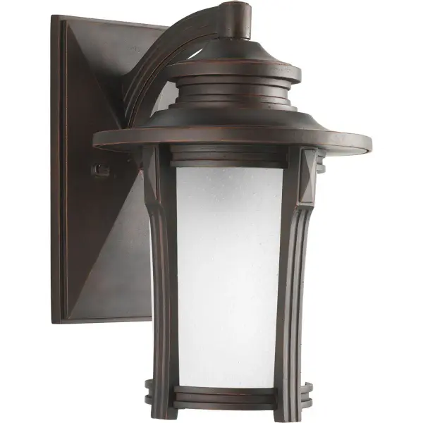 The Pedigree wall lantern blends modern clean lines with rustic farmhouse charm in a durable outdoor-rated fixture. Its medium size and Autumn Haze finish make it versatile for residential and commercial applications.