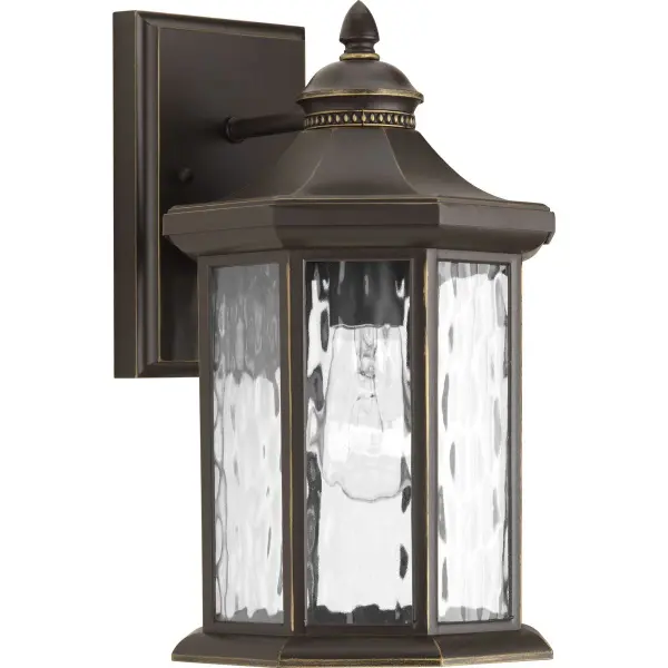 The Edition Collection wall lantern brings traditional elegance to outdoor spaces with its antique bronze finish and clear glass panels. JA8-compliant for California energy standards, this medium-sized fixture suits porches, patios, and entryways.