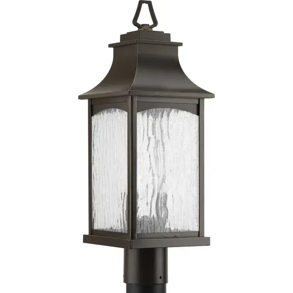 The Maison post lantern combines timeless farmhouse style with modern outdoor durability. Its textured black finish and clear glass panels create welcoming illumination for entryways, patios, and pathways.