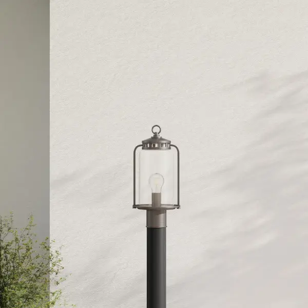 The Botta Collection post lantern combines timeless design with versatile outdoor styling. Its Antique Bronze finish and clean lines work beautifully in transitional, farmhouse, and coastal settings.