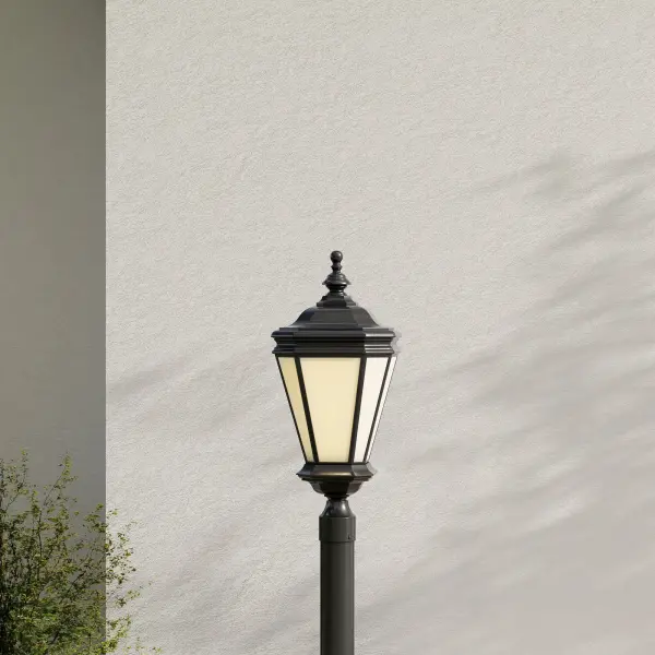 The Crawford post light combines traditional styling with modern outdoor durability. Its textured black finish and etched glass shade create warm, welcoming illumination for entryways and pathways. - alternate view
