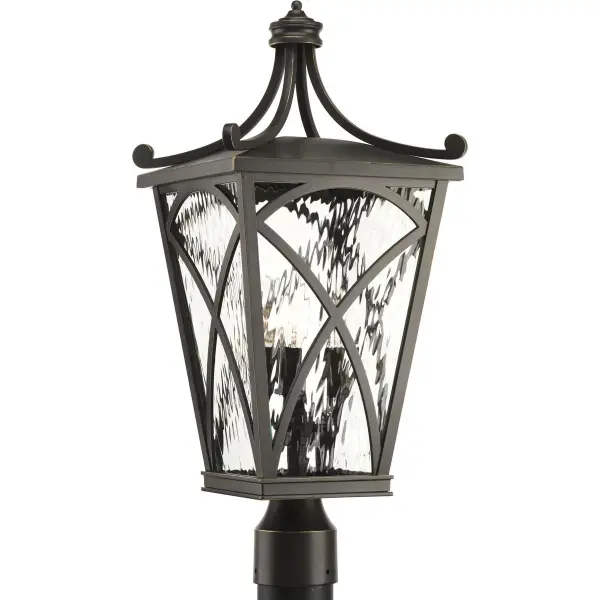 The Cadence post lantern brings traditional elegance to outdoor spaces with its three-light design and oil rubbed bronze finish. Perfect for illuminating pathways, driveways, and entryways with classic style.
