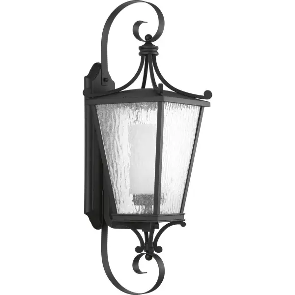 The Cadence Large Wall Lantern combines timeless traditional design with contemporary outdoor lighting technology. Its textured black finish and substantial size make it ideal for creating a welcoming entrance.