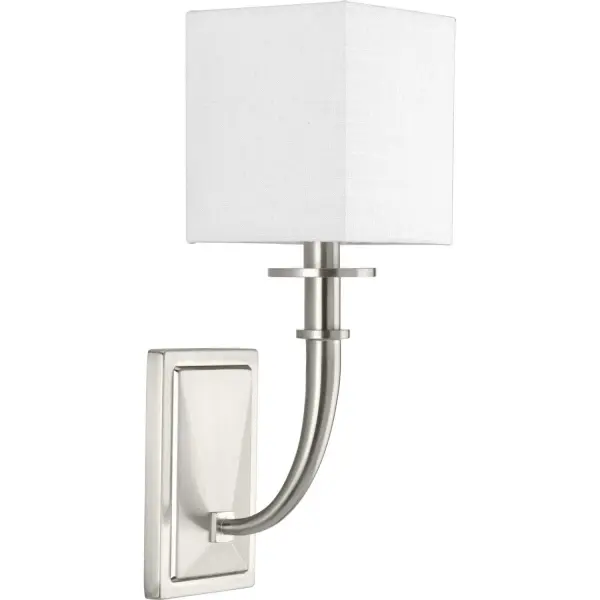 Avana features a graceful arching tapered candle-arm with a crisp geometric linen shade. The faceted backplate provides a rich architectural detail that complements many fashionable vanity styles. Brushed Nickel finish. Collection: Avana Finish: Brushed Nickel Glass: White Linen Width: 5.63" Height: 16.00" Weight: 3.43 lb Extension from Wall: 7.50" Top to Outlet: 12.50" Wire: 6" Canopy: 1"x7"x4.5" Number of Bulbs: 1 Maximum Wattage: 60.00 W Bulb Type: T8 Bulb Base: E12 Light Source: Incandescent Voltage: 120.00 V Material: Steel Country of Origin: CN Safety Listing: cULus Safety Rating: Dry Title 20 Manufacturer Warranty: 1-year Limited Warranty Spec Sheet Instructions Parts Diagram