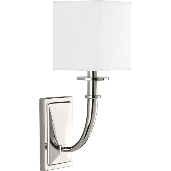 The Avana wall sconce delivers refined lighting with its polished nickel finish and clean transitional styling. Perfect for hallways, bedrooms, and dining spaces, this compact fixture adds sophisticated illumination.