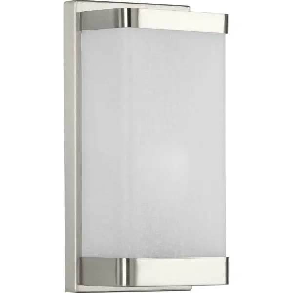 This modern wall sconce features distinctive linen-textured glass that diffuses light beautifully, paired with a brushed nickel finish. Perfect for bathrooms, hallways, and dining spaces where subtle elegance is desired. - alternate view