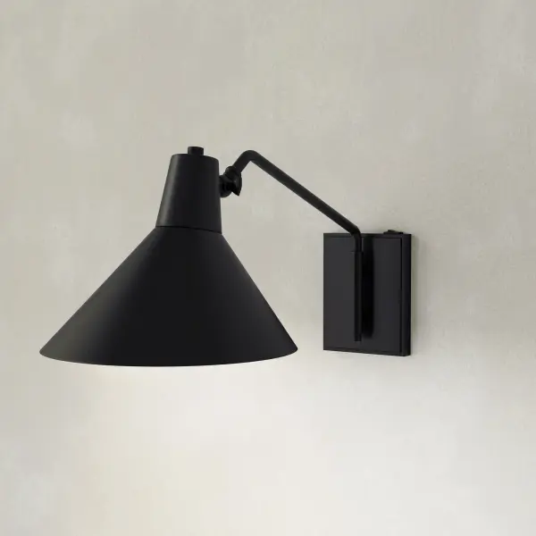 The Trimble wall bracket combines mid-century modern elegance with industrial styling in a brushed bronze finish. Perfect for adding ambient lighting to hallways, bedrooms, and dining spaces with its refined aesthetic. - alternate view