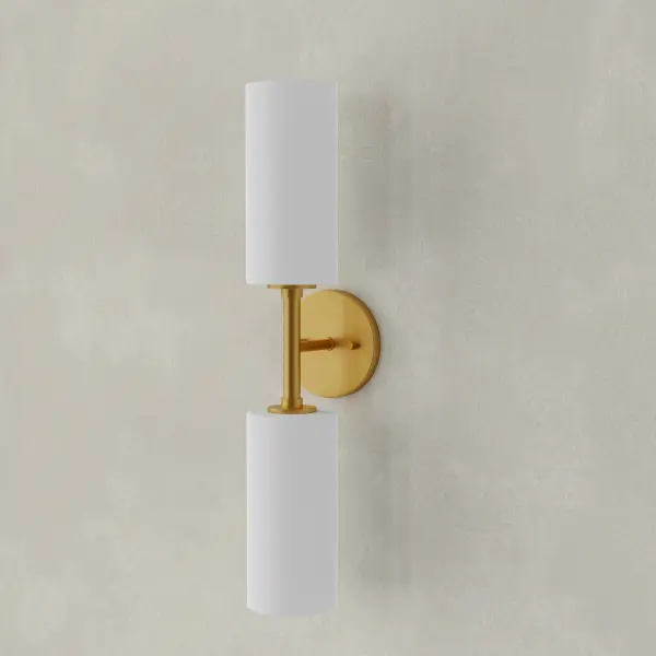 The Cofield two-light wall sconce brings mid-century modern elegance to any space with its brushed nickel finish and contemporary design. Perfect for bathrooms, hallways, and dining areas, this fixture offers versatile lighting in a compact profile.