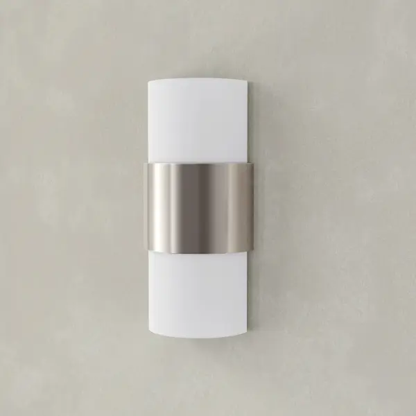 The Silva wall sconce combines brushed nickel hardware with white linen shades for a refined, versatile look. Its two-light design provides balanced illumination perfect for bathrooms, hallways, and bedrooms.