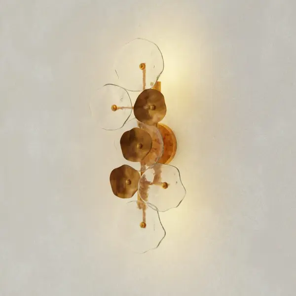 The Loretta wall sconce brings sophisticated transitional style with its distinctive gold ombre finish. Four lights provide ample illumination while the organic modern design adds visual interest to bathrooms, dining rooms, and hallways. - alternate view