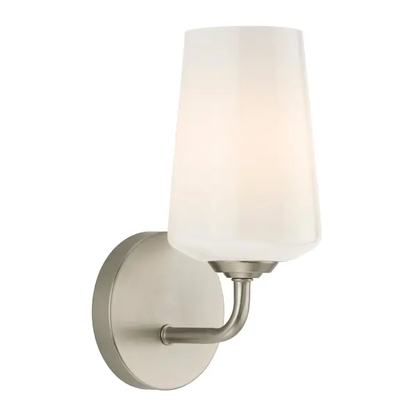 The Celino wall sconce delivers clean, contemporary styling with transitional appeal. Its brushed nickel finish and glass shade provide reliable task and ambient lighting for bathrooms, hallways, and bedrooms.