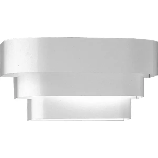 This 7-inch wall sconce features a distinctive louvered design that creates soft, diffused light perfect for hallways and bedrooms. The clean white finish and compact profile make it ideal for modern residential spaces. - alternate view