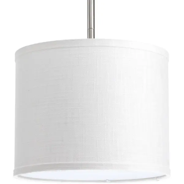 The Markor 10" drum shade in Summer Linen offers a versatile, modern aesthetic perfect for kitchen islands and dining areas. Its neutral fabric finish complements various decor styles while providing soft, diffused light.