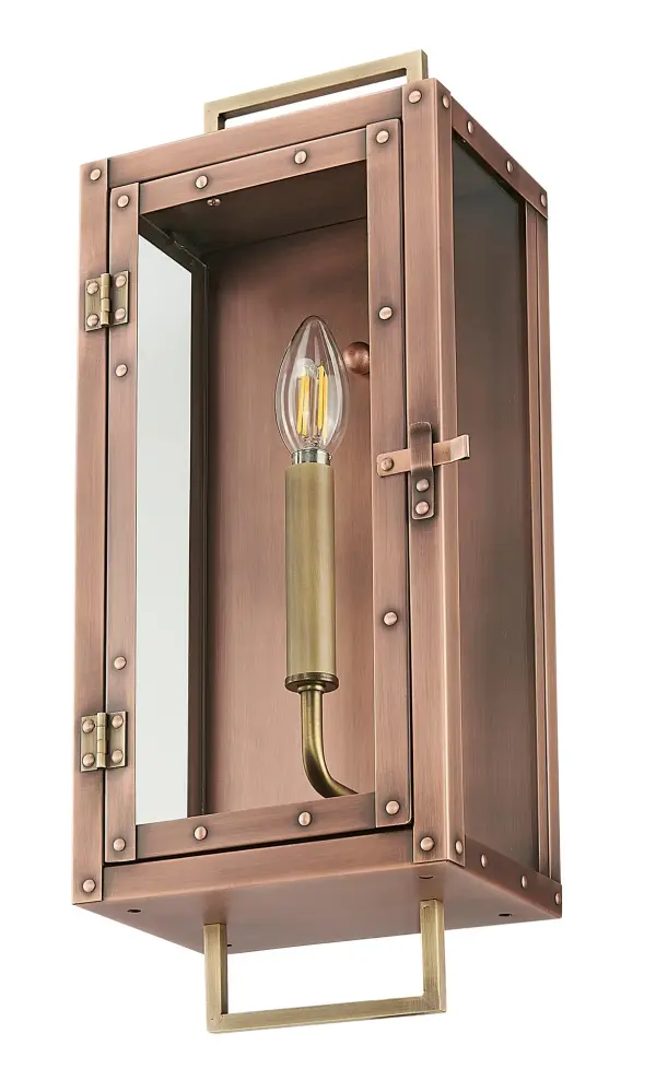 The Spencer wall sconce combines traditional craftsmanship with durable copper construction and clear glass. Its compact 7-inch width and 18-inch height make it ideal for flanking doorways or illuminating outdoor spaces with warm, inviting light.