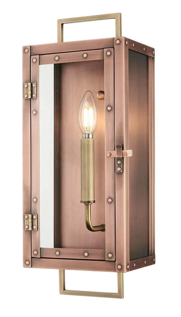 The Spencer wall sconce combines traditional craftsmanship with durable copper construction and clear glass. Its compact 7-inch width and 18-inch height make it ideal for flanking doorways or illuminating outdoor spaces with warm, inviting light. - alternate view