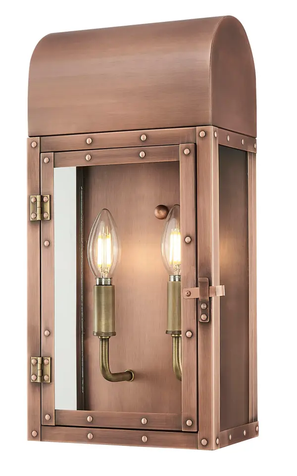 The Spencer 2-Light Wall Sconce combines traditional craftsmanship with durable copper construction. Its copper patina finish develops character over time while clear glass panels provide warm, welcoming illumination for outdoor spaces. - alternate view