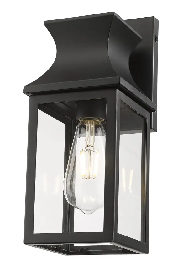The Stockwell wall sconce combines traditional lantern styling with modern matte black finish. Its compact 5.25" width makes it ideal for smaller outdoor spaces while providing reliable illumination. - alternate view