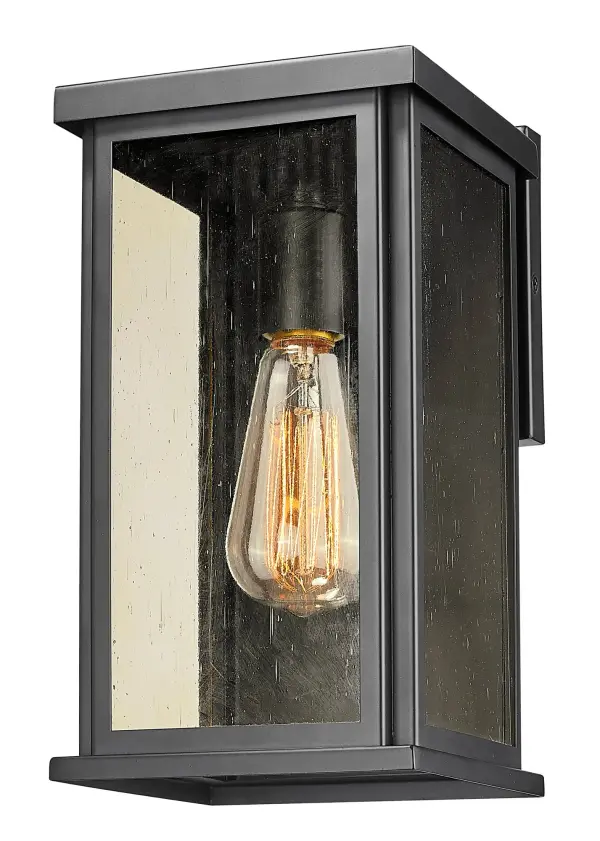 The Lyons wall sconce combines industrial charm with transitional elegance. Its matte black steel construction and champagne seedy glass create warm, ambient lighting perfect for outdoor entryways and patios. - alternate view