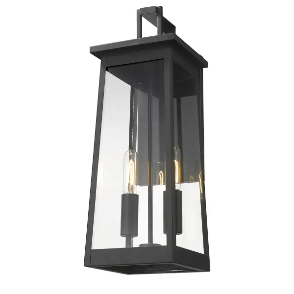 The Alden 2-Light Wall Sconce combines clean lines with industrial styling in a durable matte black finish. Clear glass shades showcase vintage-style bulbs while the steel construction ensures weather resistance for outdoor applications. - alternate view