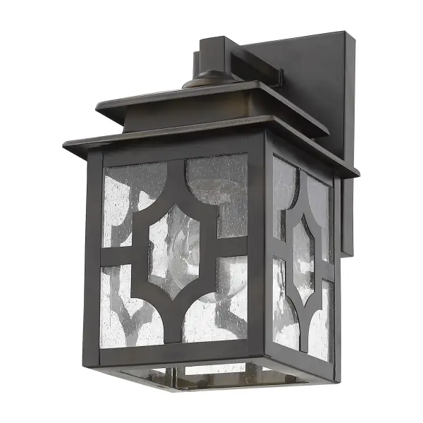 The Calvert wall sconce combines traditional styling with durable steel construction and charming seeded glass. Its compact 10-inch height and oil-rubbed bronze finish make it ideal for flanking doors or illuminating outdoor spaces.