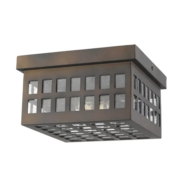 The Letzel flush mount combines durability with style, featuring stainless steel construction and seeded glass for visual interest. Its compact 8.75-inch profile makes it ideal for covered outdoor spaces.