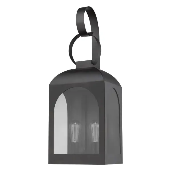 The Madigan 2-Light Wall Sconce combines substantial scale with clean-lined design. Its oil-rubbed bronze finish and clear glass panes create dramatic illumination for outdoor spaces, while stainless steel construction ensures durability.