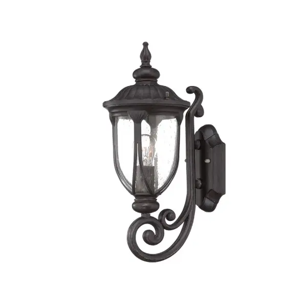 The Laurens wall sconce combines durable cast aluminum construction with hand-blown seeded glass for a timeless outdoor lighting solution. Its compact 16.5" height and traditional styling make it versatile for various exterior applications.