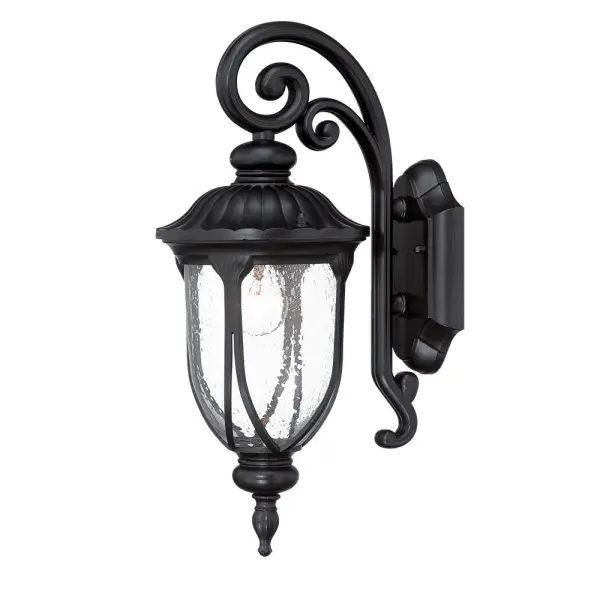 The Laurens wall sconce combines durable cast aluminum construction with charming seeded glass for a timeless outdoor lighting solution. Its matte black finish and traditional design complement various architectural styles.
