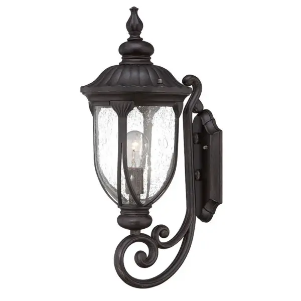 The Laurens wall sconce combines durable cast aluminum construction with clear seeded glass for a timeless outdoor lighting solution. Its traditional design with coastal influences makes it versatile for various exterior applications.