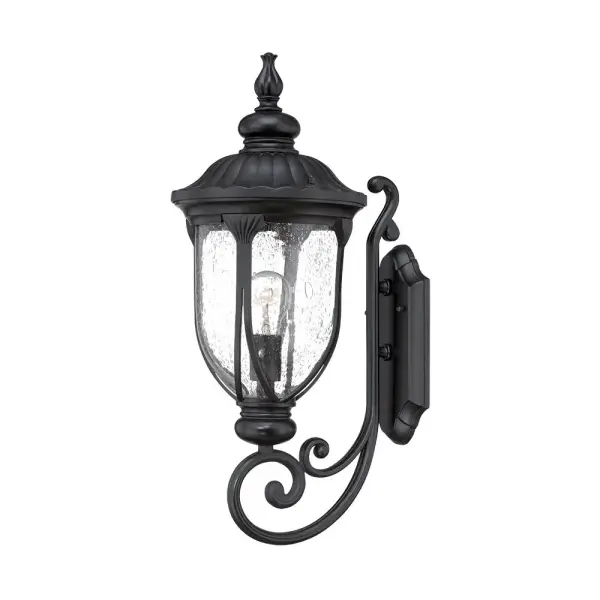 The Laurens wall sconce combines durable cast aluminum construction with charming seeded glass for a timeless outdoor lighting solution. Its matte black finish and traditional design complement various architectural styles.