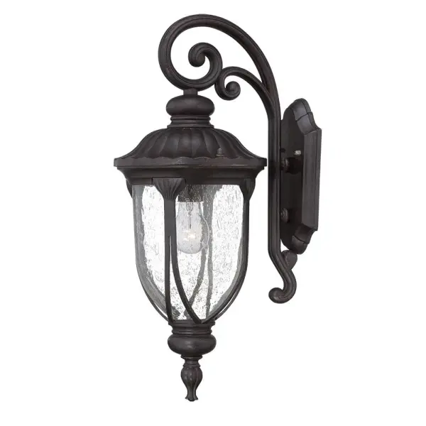 The Laurens wall sconce combines traditional styling with weather-resistant cast aluminum construction. Clear seeded glass creates ambient lighting while the Black Coral finish adds coastal charm to any outdoor space.