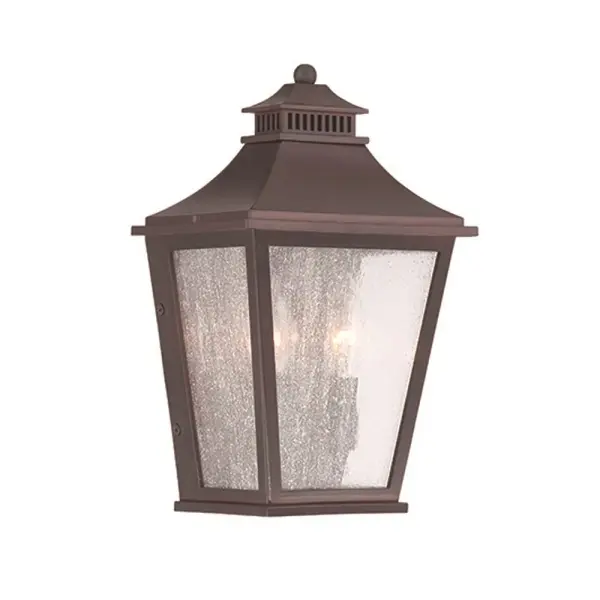The Chapel Hill 2-Light Wall Sconce combines traditional styling with durable outdoor construction. Its architectural bronze finish and clear seeded glass create warm, welcoming illumination for entryways and outdoor spaces.