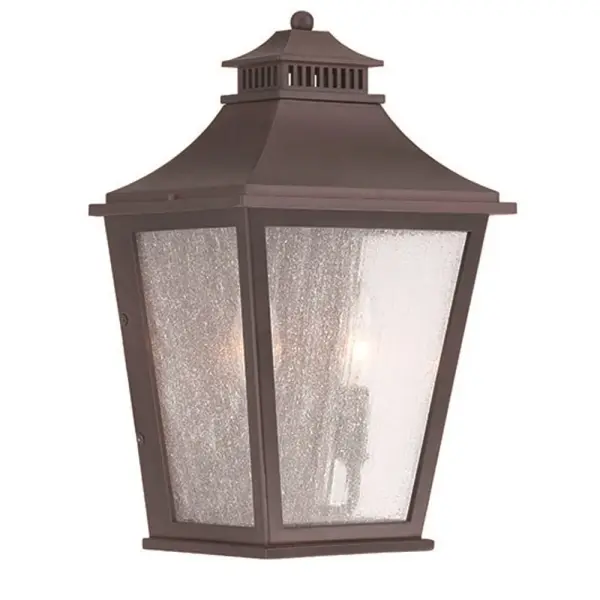 The Chapel Hill 2-Light Wall Sconce combines traditional design with durable outdoor construction. Featuring clear seeded glass and architectural bronze finish, it provides warm ambient lighting for entryways and outdoor spaces.