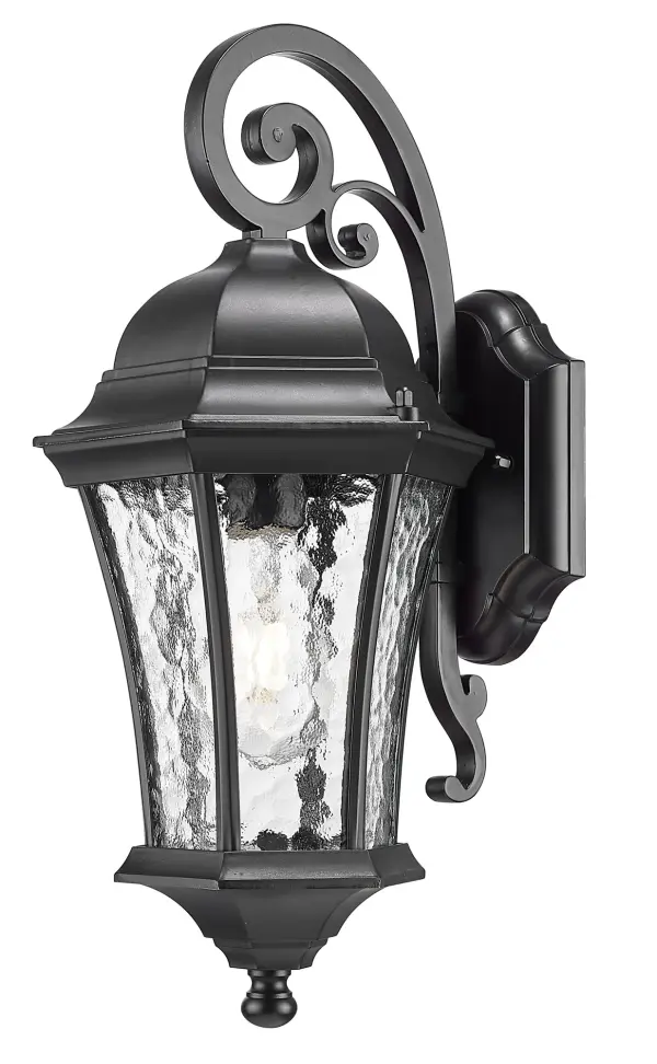 The Waverly wall sconce combines cast aluminum durability with distinctive hammered water glass for a coastal aesthetic. Its matte black finish and transitional design work equally well in traditional and contemporary outdoor settings.
