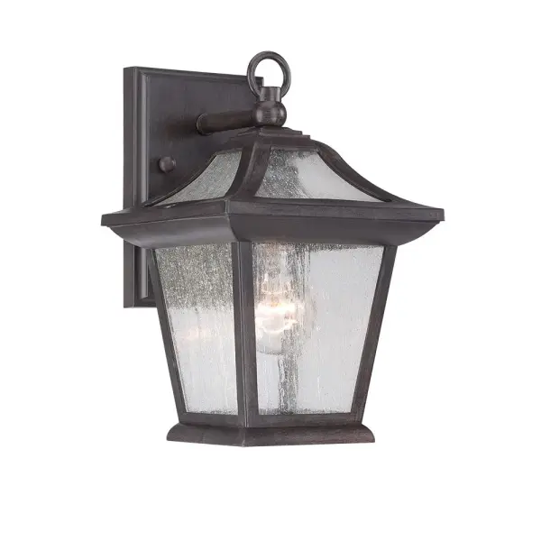 The Aiken wall sconce combines weather-resistant MarbleX® construction with clear seeded glass for a sophisticated outdoor lighting solution. Its compact 11-inch height and black coral finish deliver coastal elegance.