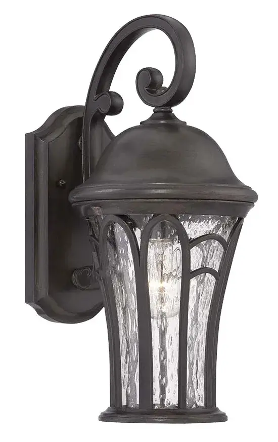 The Highgate wall lantern combines traditional styling with modern durability. Its MarbleX composite construction resists weathering while the clear seeded glass creates warm ambient lighting for outdoor spaces.