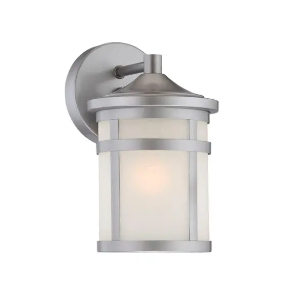 The Austin wall sconce combines brushed steel construction with frosted glass for a versatile outdoor lighting solution. Its compact 9.25" height and 6.75" extension make it ideal for smaller spaces while providing ample illumination.