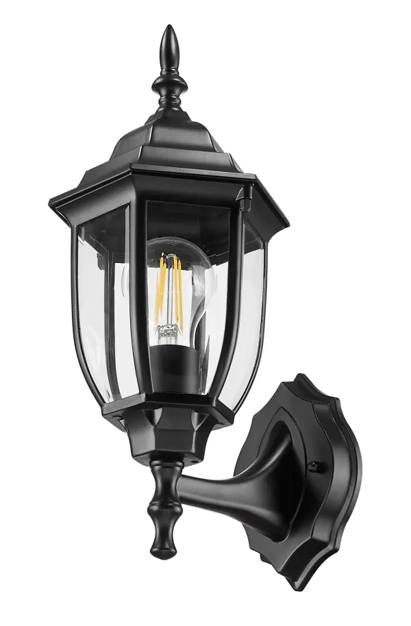 The Wexford wall lantern combines traditional styling with modern durability. Featuring cast aluminum construction and clear beveled glass, this compact fixture delivers reliable outdoor lighting with timeless appeal.