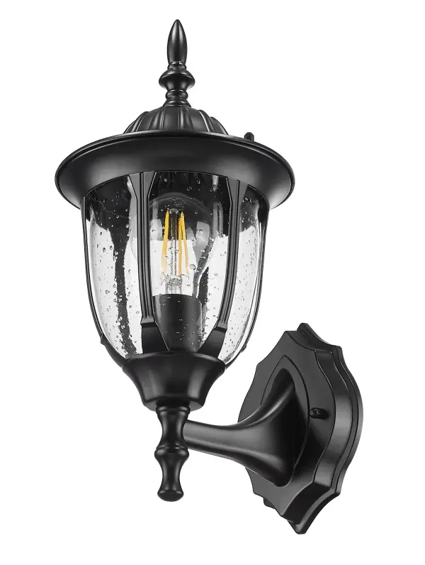 The Suffolk wall mount combines traditional styling with durable cast aluminum construction. Its clear seeded glass creates ambient lighting perfect for outdoor entryways and porches.