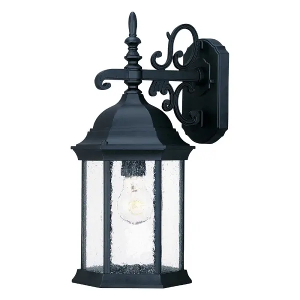 The Madison wall sconce combines durable cast aluminum construction with charming seeded glass for a traditional outdoor lighting solution. Its compact 15-inch height and matte black finish make it versatile for various exterior applications.