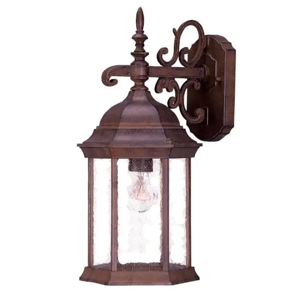 The Madison wall sconce combines traditional styling with modern durability. Its cast aluminum construction in a rich Burled Walnut finish resists the elements, while clear seeded glass panes create warm, textured light perfect for welcoming entryways and outdoor living spaces.