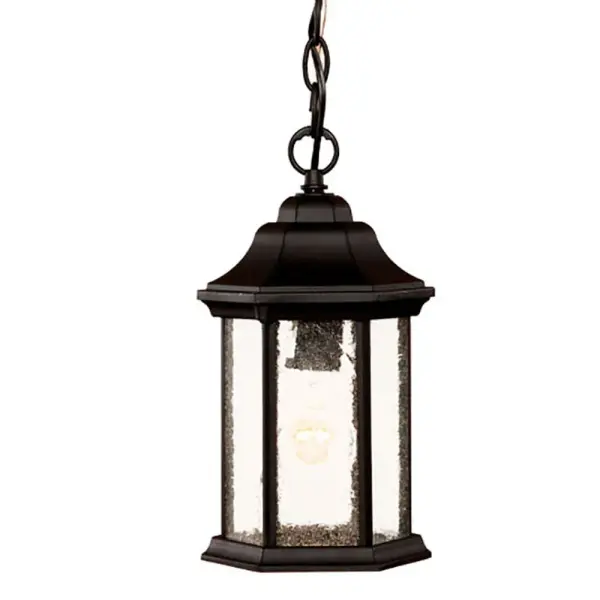 The Madison hanging lantern combines traditional lantern styling with durable cast aluminum construction. Its compact 12-inch height and seeded glass panes create charming ambient lighting for covered outdoor spaces.
