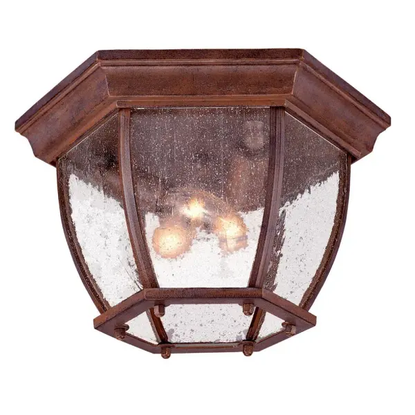 This compact 3-light flush mount combines cast aluminum durability with traditional styling. The burled walnut finish and clear seeded glass create warm, inviting illumination perfect for covered outdoor spaces.