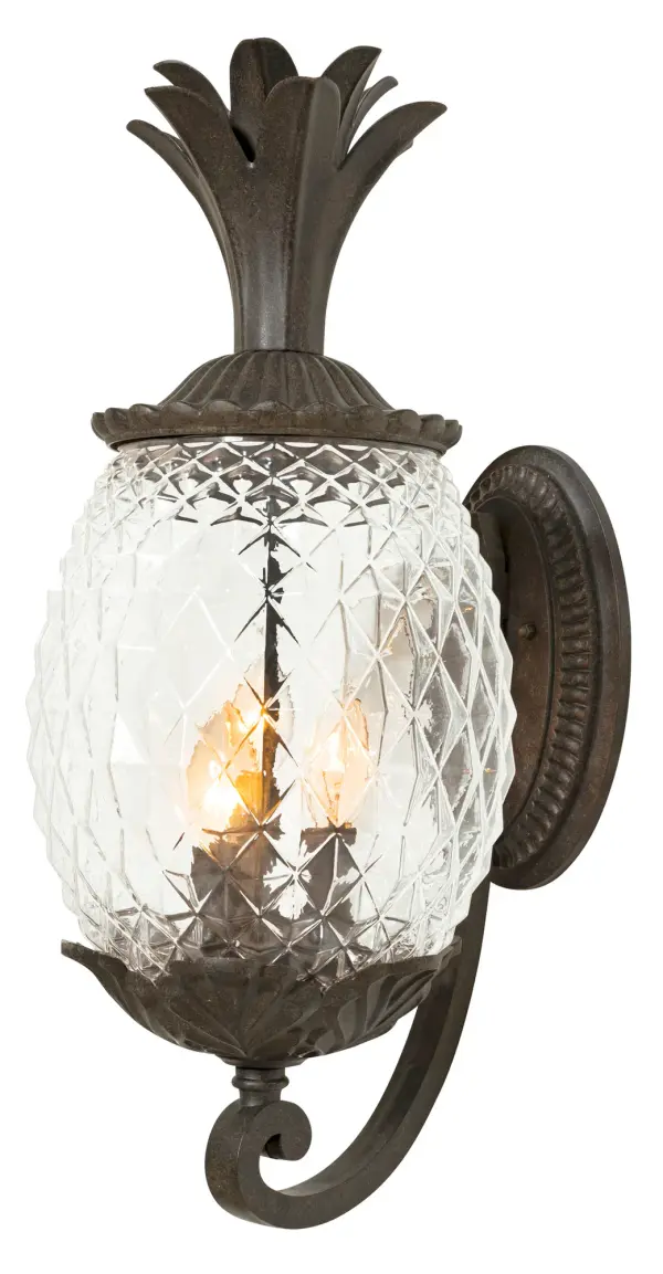 The Lanai 3-Light Wall Mount brings coastal charm to outdoor spaces with its cast aluminum construction and signature pineapple-cut glass globes. Durable Black Coral finish resists weather while providing warm, welcoming illumination. - alternate view