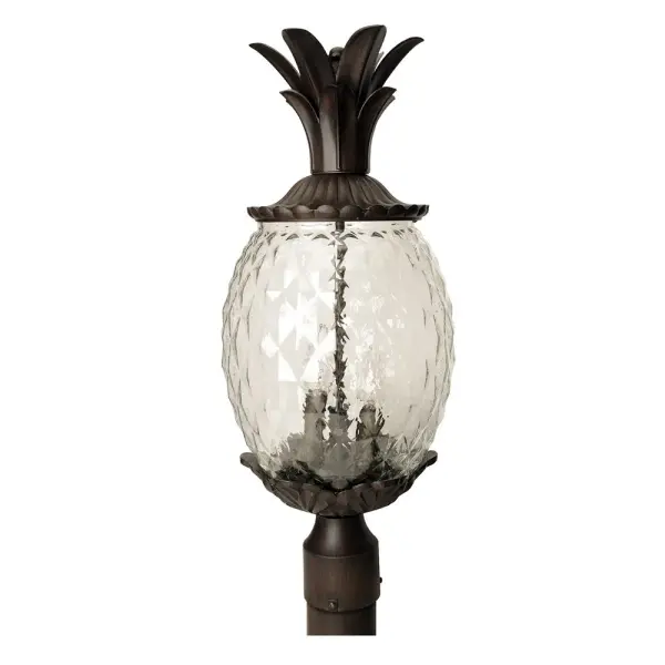 The Lanai 3-Light Post Mount brings coastal charm to outdoor spaces with its cast aluminum construction and unique pineapple-cut glass globes. The Black Coral finish offers durability and style for tropical and traditional settings.