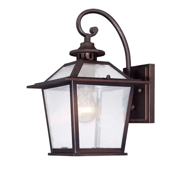 The Salem 1-Light Wall Lantern combines traditional styling with durable powder-coated steel construction. Its architectural bronze finish and clear seeded glass create warm, inviting illumination for entryways and outdoor spaces.